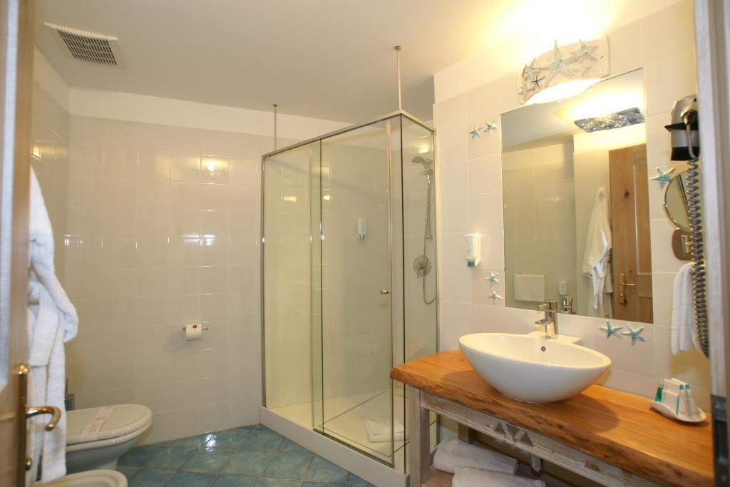 Hotel Resort & Spa Baia Caddinas Golfo Aranci Habitación foto